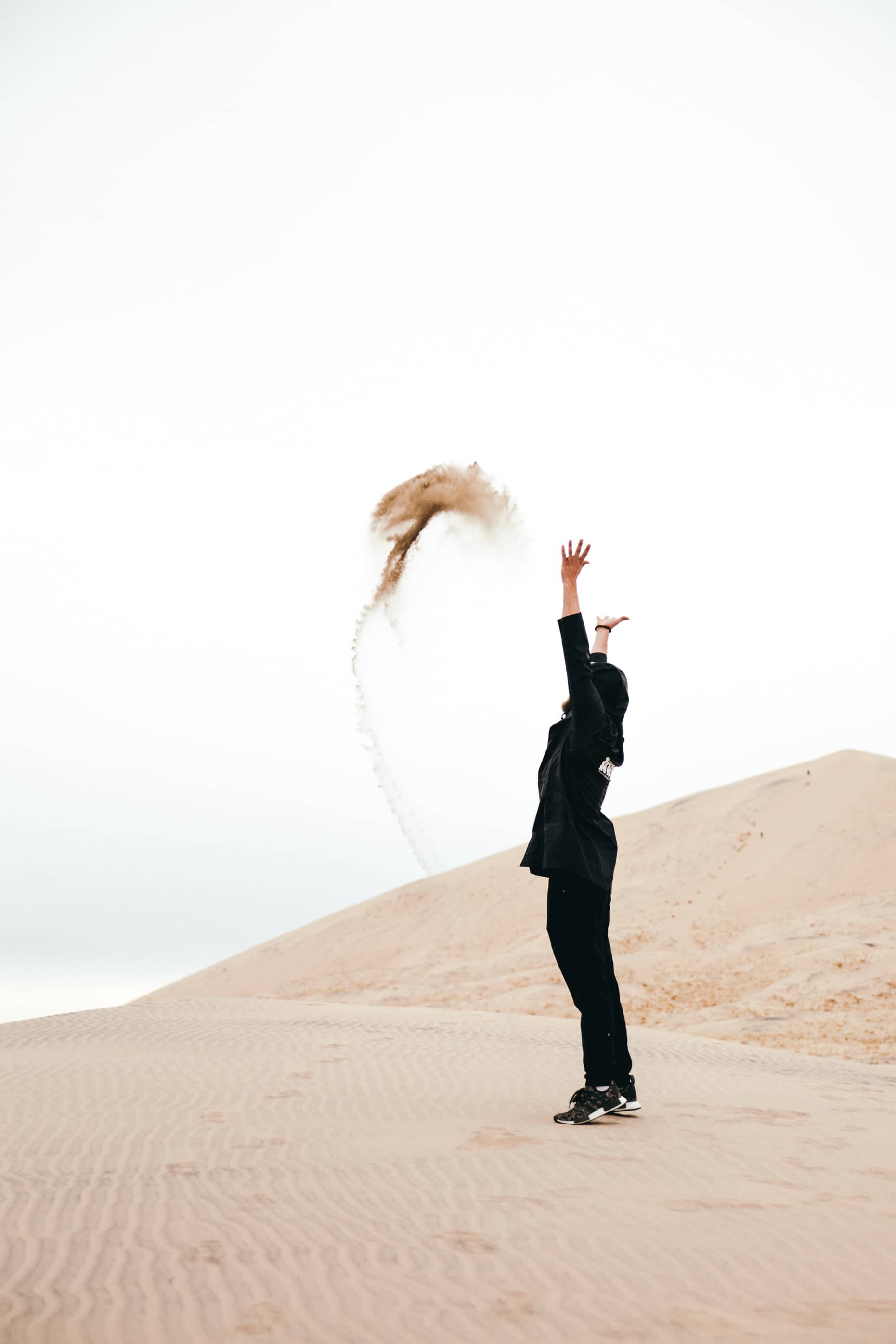 woman throwing sand
